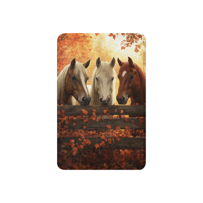 Blanket showcasing three elegant horses standing behind a rustic wooden fence
