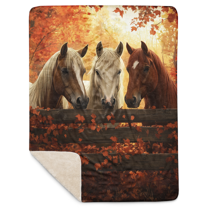 Blanket showcasing three elegant horses standing behind a rustic wooden fence