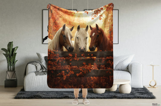 Blanket showcasing three elegant horses standing behind a rustic wooden fence